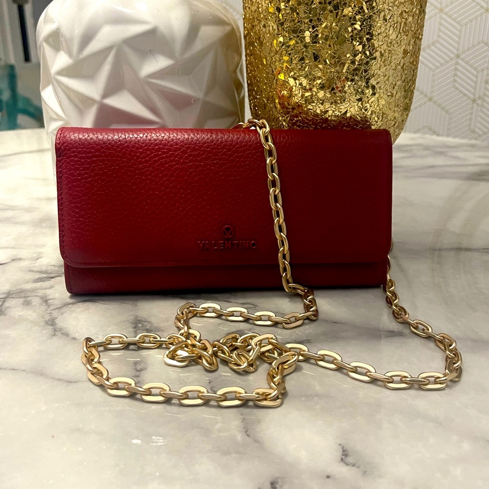 NWOT Valentino red crossbody wallet with gold chain.